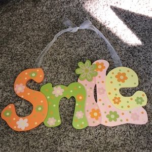 ‘Smile’ hanging sign